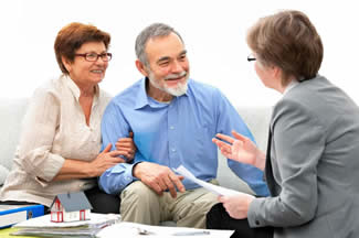 Image of three adults in conversation
