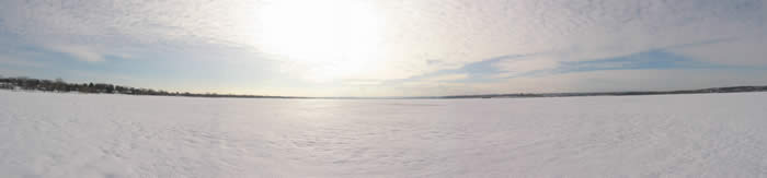 A view towards the city of Syracuse from the ice at North Deep on Onondaga lake.